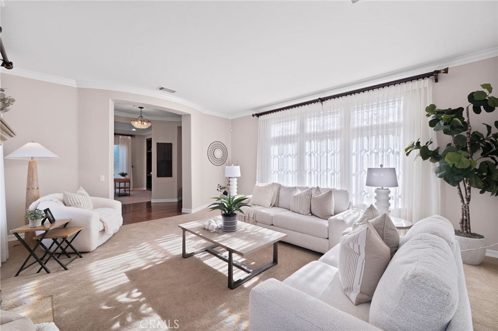 6364 Hidden Brook Place Rancho Cucamonga, CA 91739 - Photo 33 of 61 a living room with furniture and a large window