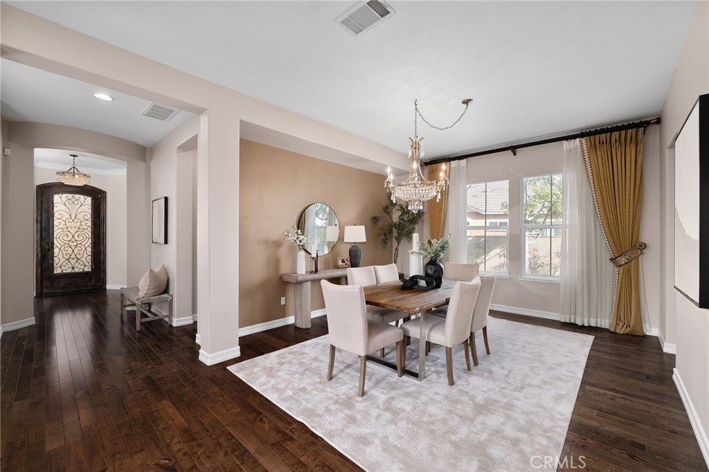 6364 Hidden Brook Place Rancho Cucamonga, CA 91739 - Photo 34 of 61 a view of a dining room with furniture window and wooden floor