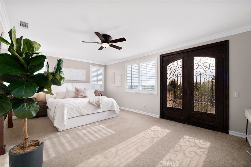 6364 Hidden Brook Place Rancho Cucamonga, CA 91739 - Photo 37 of 61 a spacious bedroom with a large bed and a potted plant
