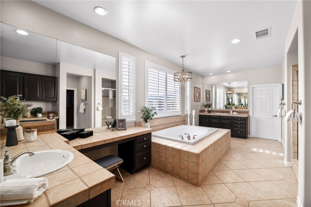 6364 Hidden Brook Place Rancho Cucamonga, CA 91739 - Photo 38 of 61 a room with a table chairs and view living room