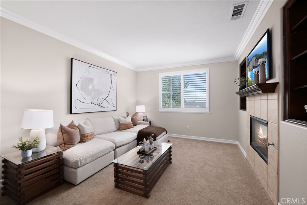 6364 Hidden Brook Place Rancho Cucamonga, CA 91739 - Photo 40 of 61 a living room with furniture and a window