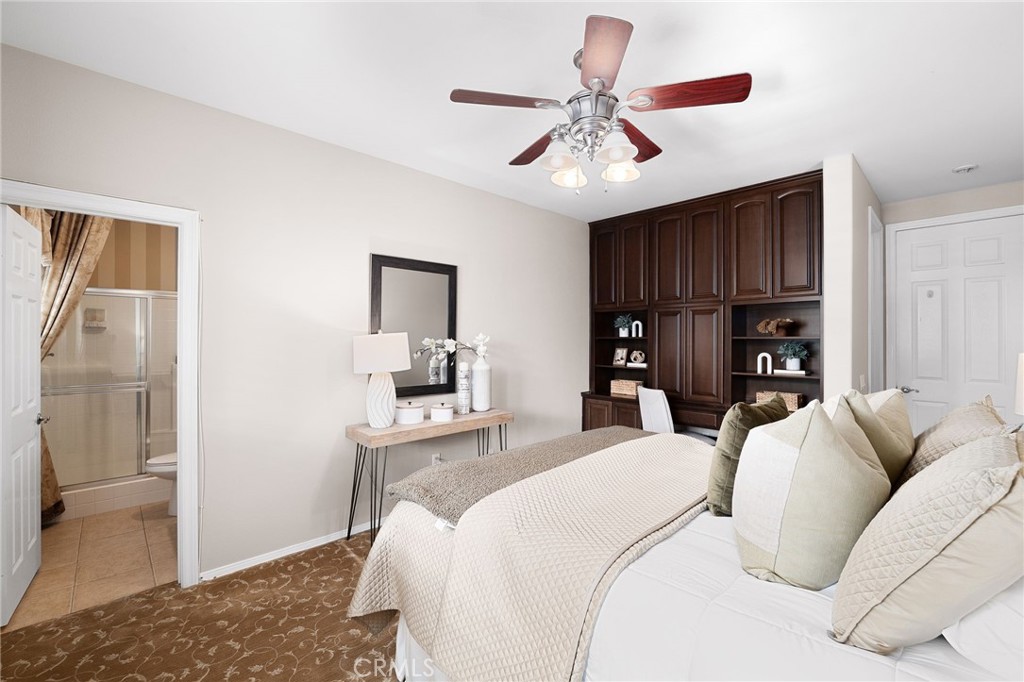 6364 Hidden Brook Place Rancho Cucamonga, CA 91739 - Photo 42 of 61 a bedroom with a bed and a view of kitchen