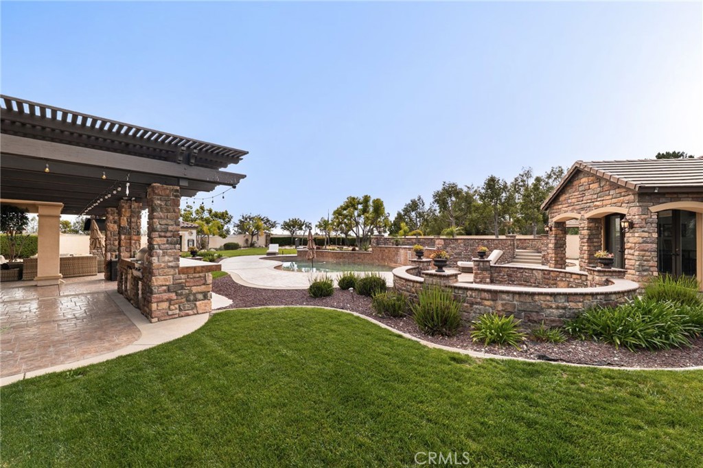 6364 Hidden Brook Place Rancho Cucamonga, CA 91739 - Photo 44 of 61 a view of a house with swimming pool and sitting area