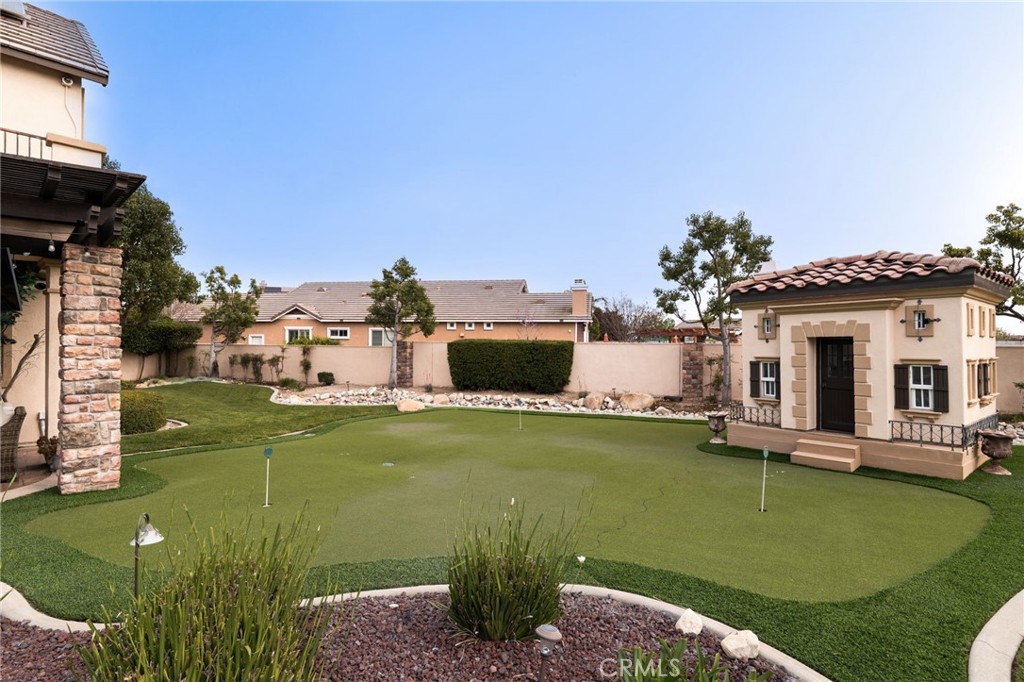 6364 Hidden Brook Place Rancho Cucamonga, CA 91739 - Photo 48 of 61 a front view of a house with garden