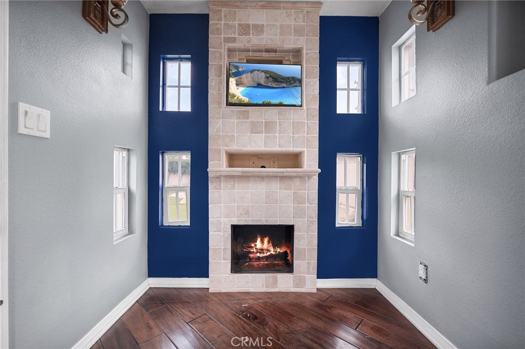 6364 Hidden Brook Place Rancho Cucamonga, CA 91739 - Photo 53 of 61 a view of a livingroom with a fireplace and window