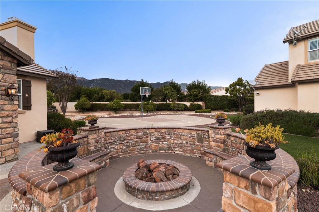 6364 Hidden Brook Place Rancho Cucamonga, CA 91739 - Photo 54 of 61 a view of a swimming pool with a patio