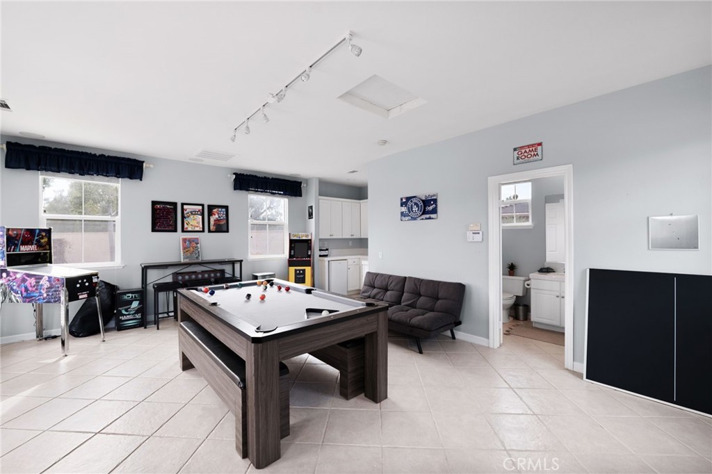 6364 Hidden Brook Place Rancho Cucamonga, CA 91739 - Photo 60 of 61 a view of a workspace with furniture and a window