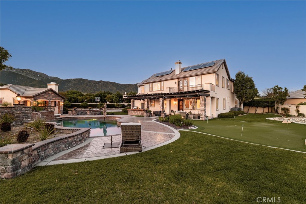 6364 Hidden Brook Place Rancho Cucamonga, CA 91739 - Photo 6 of 61 a view of a house with a big yard