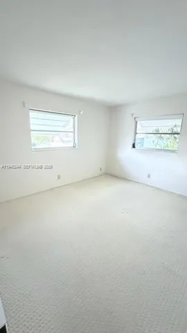 a view of a bathroom from a hallway