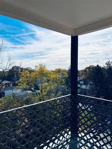 a view of a balcony with an ocean view