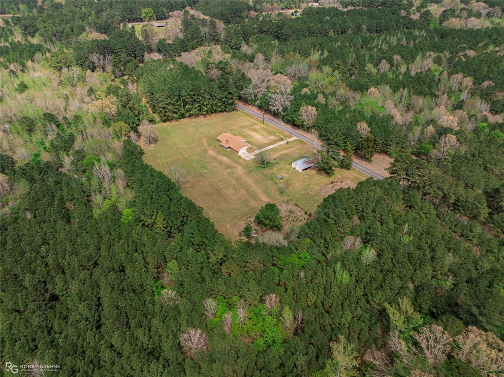 1303 Young Road Benton, LA 71006 - Photo 28 of 34 Aerial view of sparsely populated area featuring a heavily wooded area