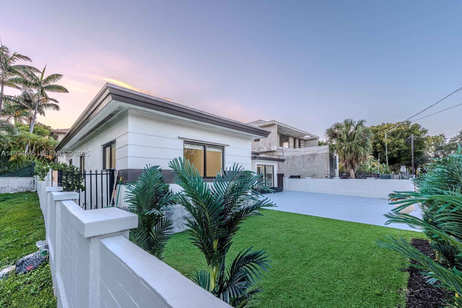 4144 Alton Road Miami Beach, FL 33140 - Photo 4 of 17 a house that has a lot of plants in it