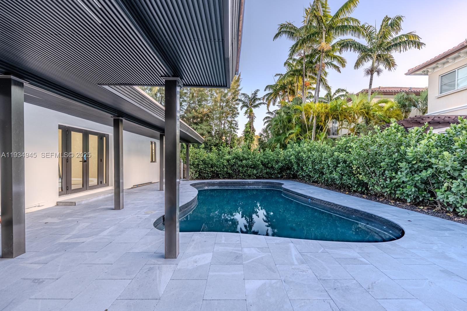 4144 Alton Road Miami Beach, FL 33140 - Photo 5 of 17 a view of outdoor space yard and porch
