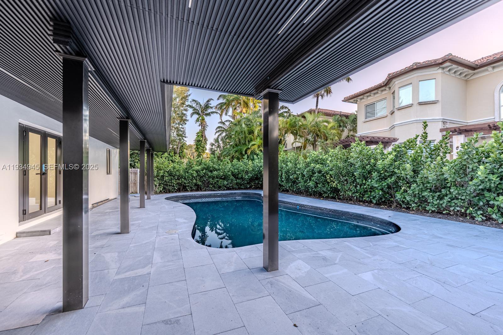 4144 Alton Road Miami Beach, FL 33140 - Photo 6 of 17 a view of a porch