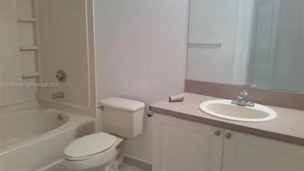 a bathroom with a sink toilet and bathtub