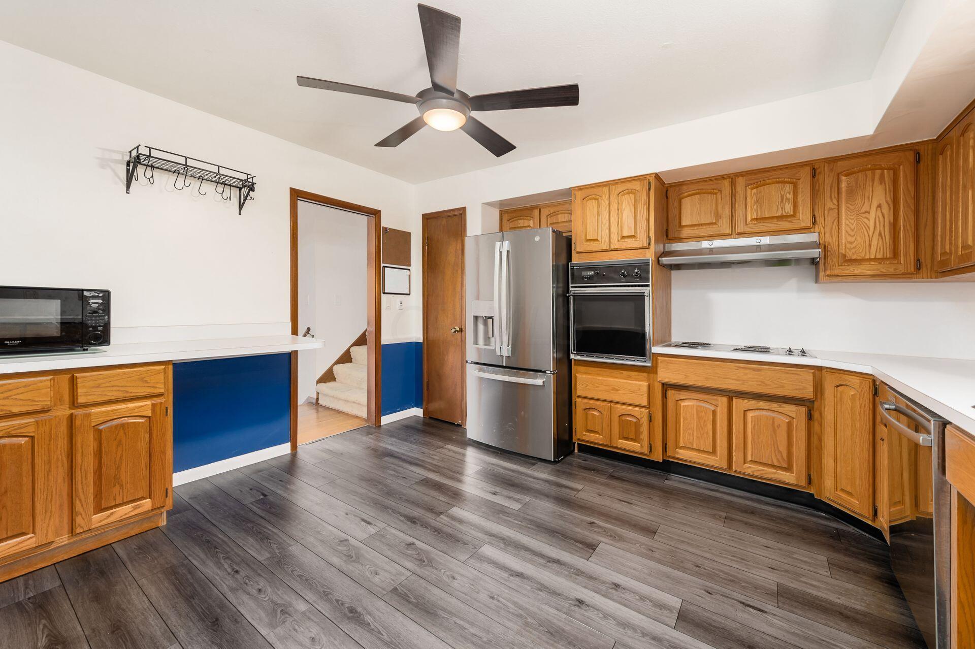 5355 Karl Road Columbus, OH 43229 - Photo 16 of 39 UPDATED KITCHEN WITH NEWER FLOORING AND STAINLESS APPLIACES
