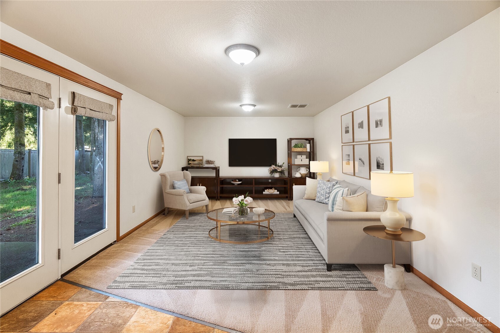 6107 189th Loop Southwest Rochester, WA 98579 - Photo 12 of 38 a living room with furniture and a flat screen tv