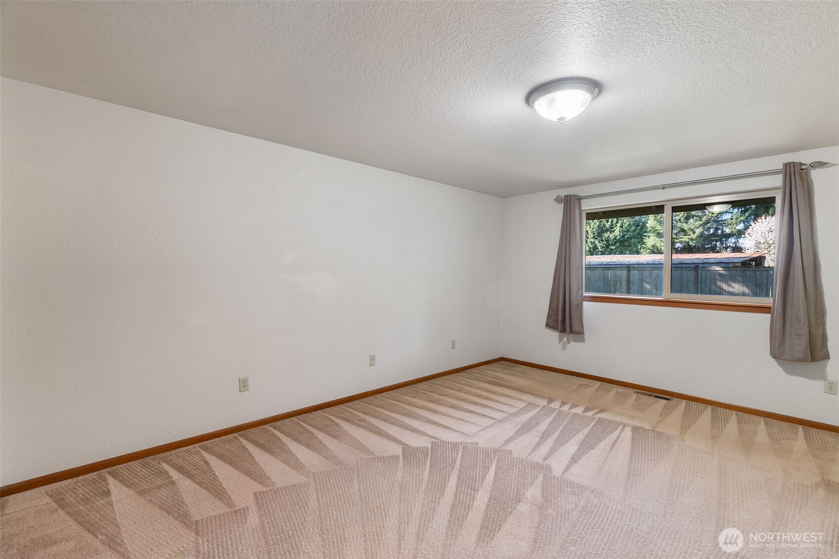 6107 189th Loop Southwest Rochester, WA 98579 - Photo 22 of 38 a view of empty room with window