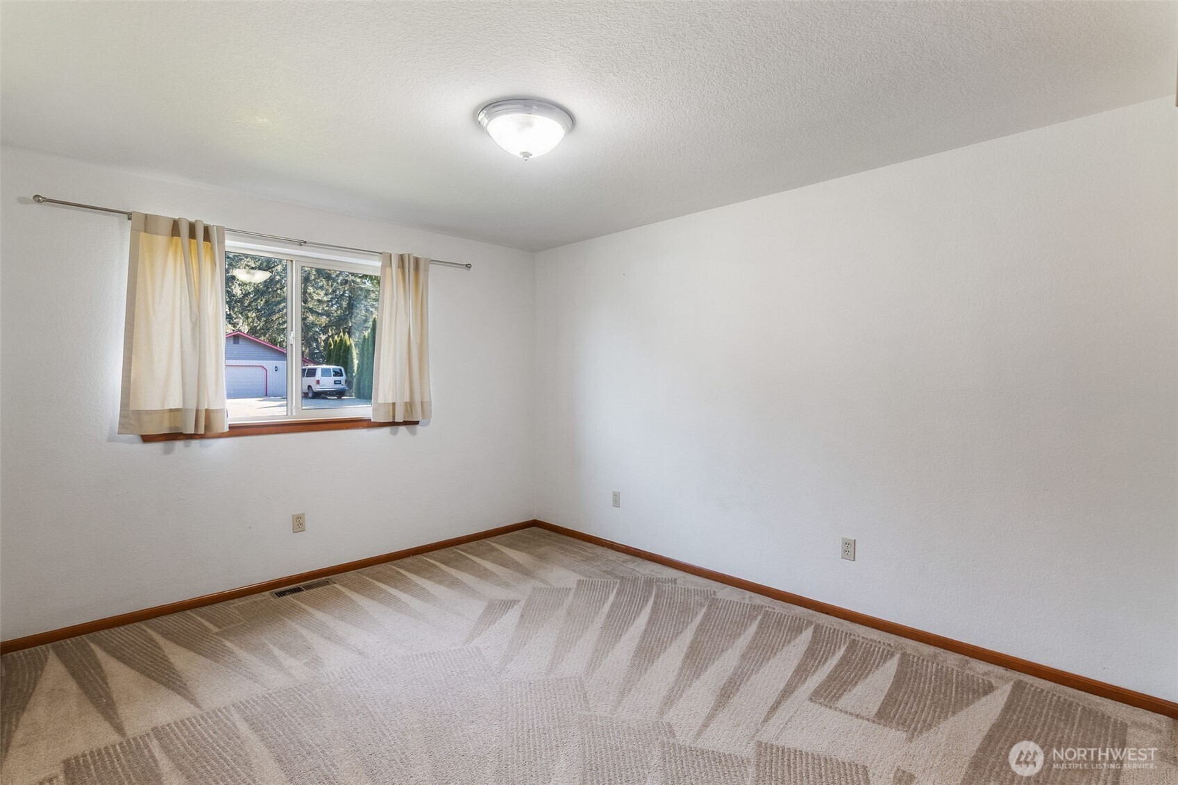 6107 189th Loop Southwest Rochester, WA 98579 - Photo 25 of 38 a view of an empty room with a window