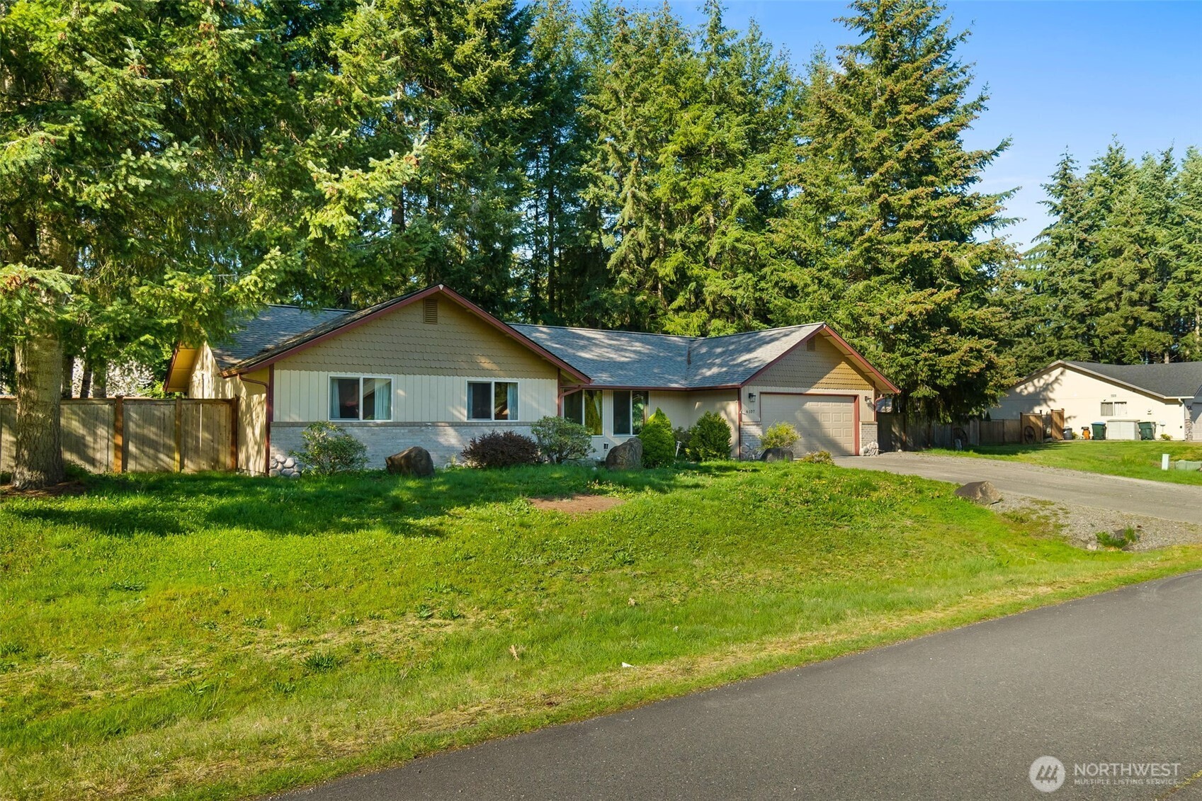 6107 189th Loop Southwest Rochester, WA 98579 - Photo 35 of 38 a front view of house with yard and green space