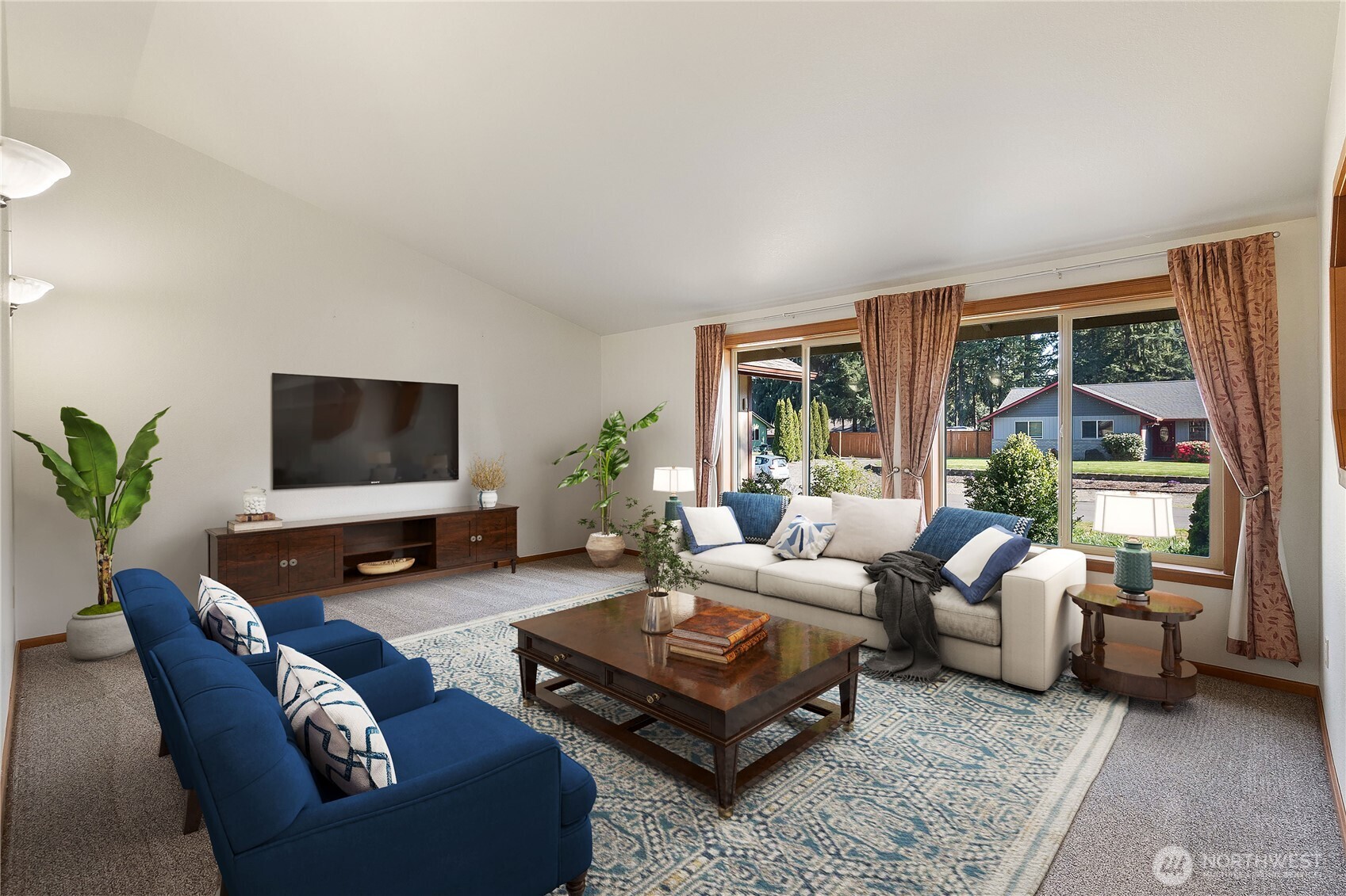 6107 189th Loop Southwest Rochester, WA 98579 - Photo 8 of 38 a living room with furniture flat screen tv and a large window