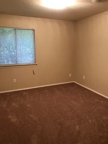 an empty room with closet area