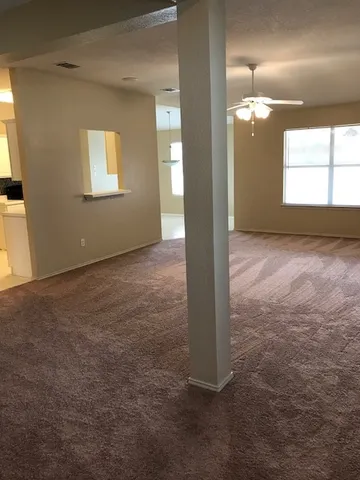 a view of an empty room and window