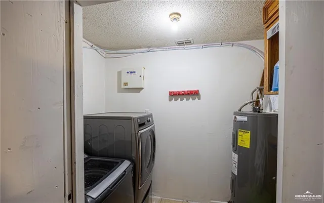 a view of storage and utility room with washer and dryer