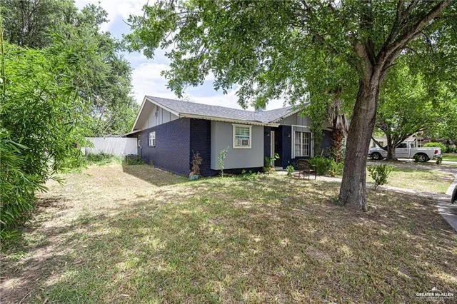 a house with trees in front of it