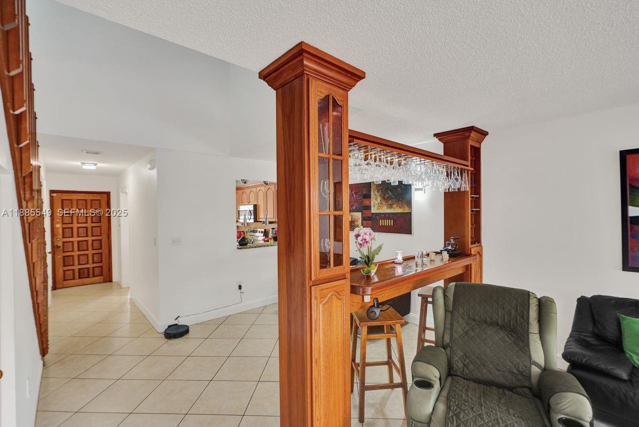 14201 Southwest 57th Lane, Unit 1A7 Miami, FL 33183 - Photo 12 of 48 a balcony view with furniture and outdoor space