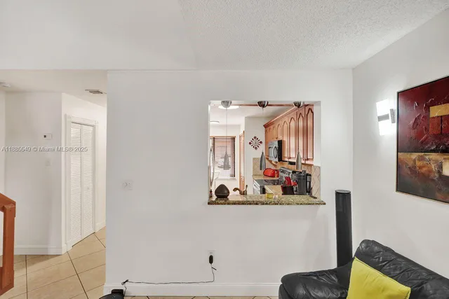 a view of room with cabinet and mirror