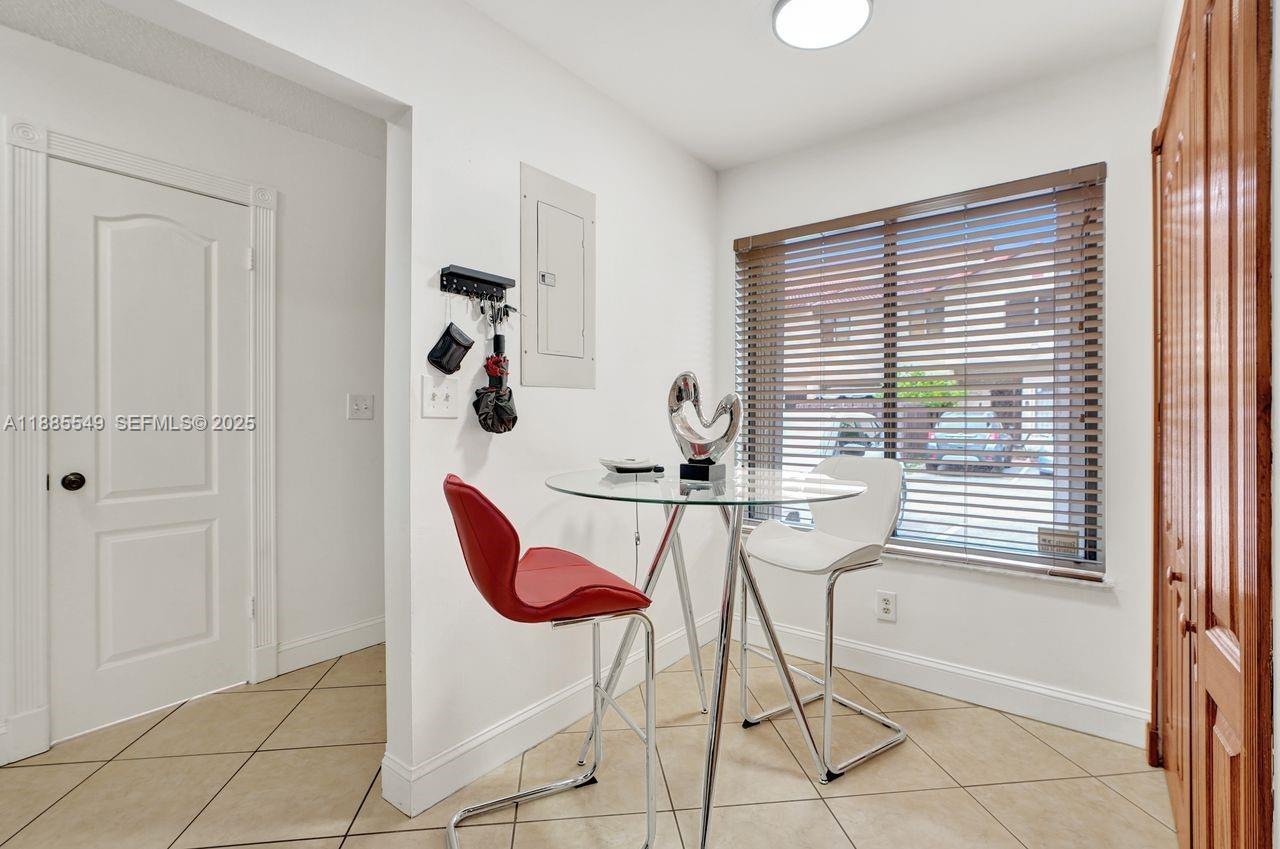 14201 Southwest 57th Lane, Unit 1A7 Miami, FL 33183 - Photo 20 of 48 a very nice looking room with a large window