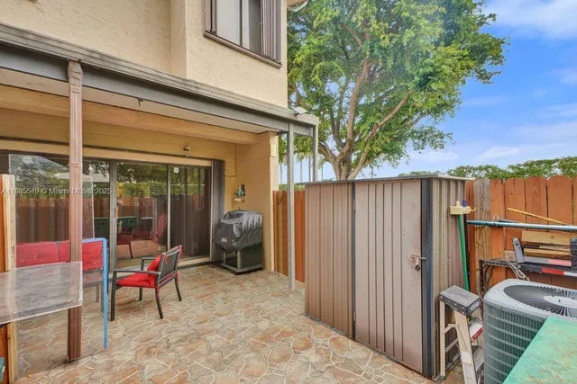 a backyard of a house with seating space