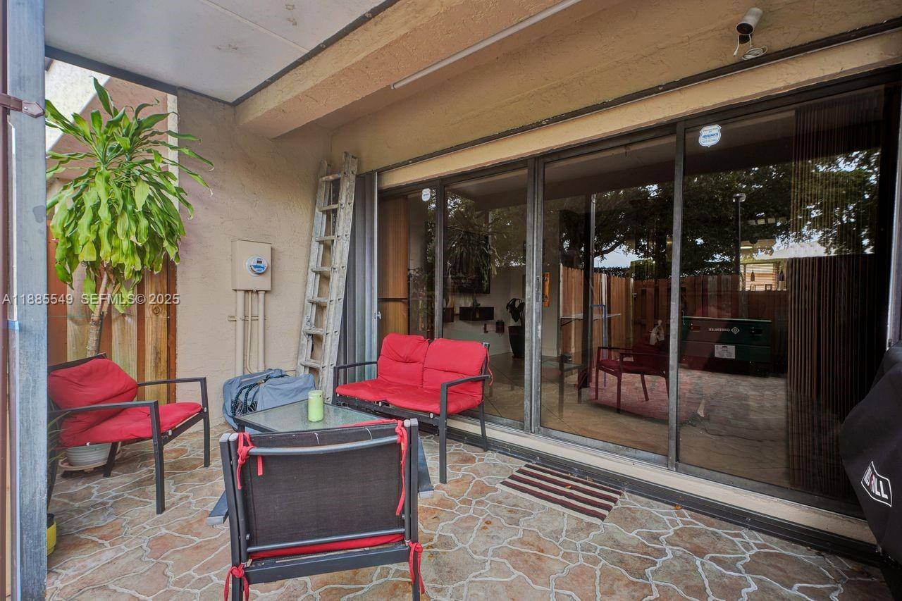 14201 Southwest 57th Lane, Unit 1A7 Miami, FL 33183 - Photo 45 of 48 a outdoor space with furniture