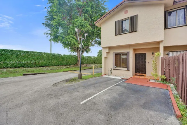 a view of backyard with large tree