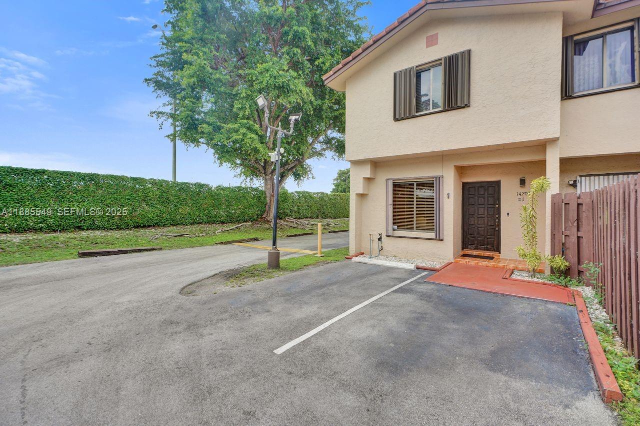 14201 Southwest 57th Lane, Unit 1A7 Miami, FL 33183 - Photo 46 of 48 a view of backyard with large tree