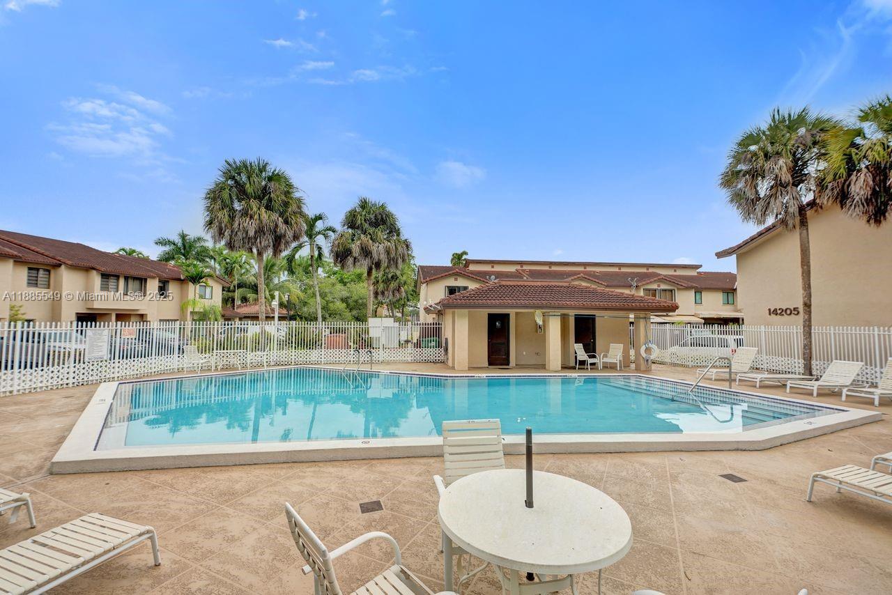 14201 Southwest 57th Lane, Unit 1A7 Miami, FL 33183 - Photo 48 of 48 a house view with a backyard space