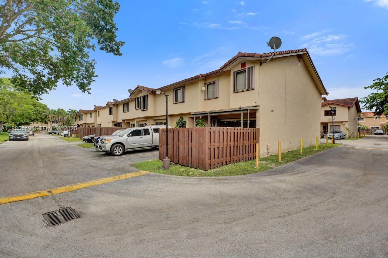 14201 Southwest 57th Lane, Unit 1A7 Miami, FL 33183 - Photo 5 of 48 a view of a street with cars