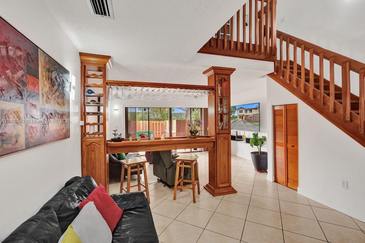 14201 Southwest 57th Lane, Unit 1A7 Miami, FL 33183 - Photo 9 of 48 a view of entryway and hall