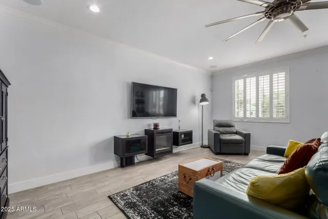 a living room with furniture and a rug