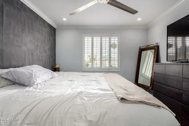 a bathroom with a sink vanity mirror and toilet