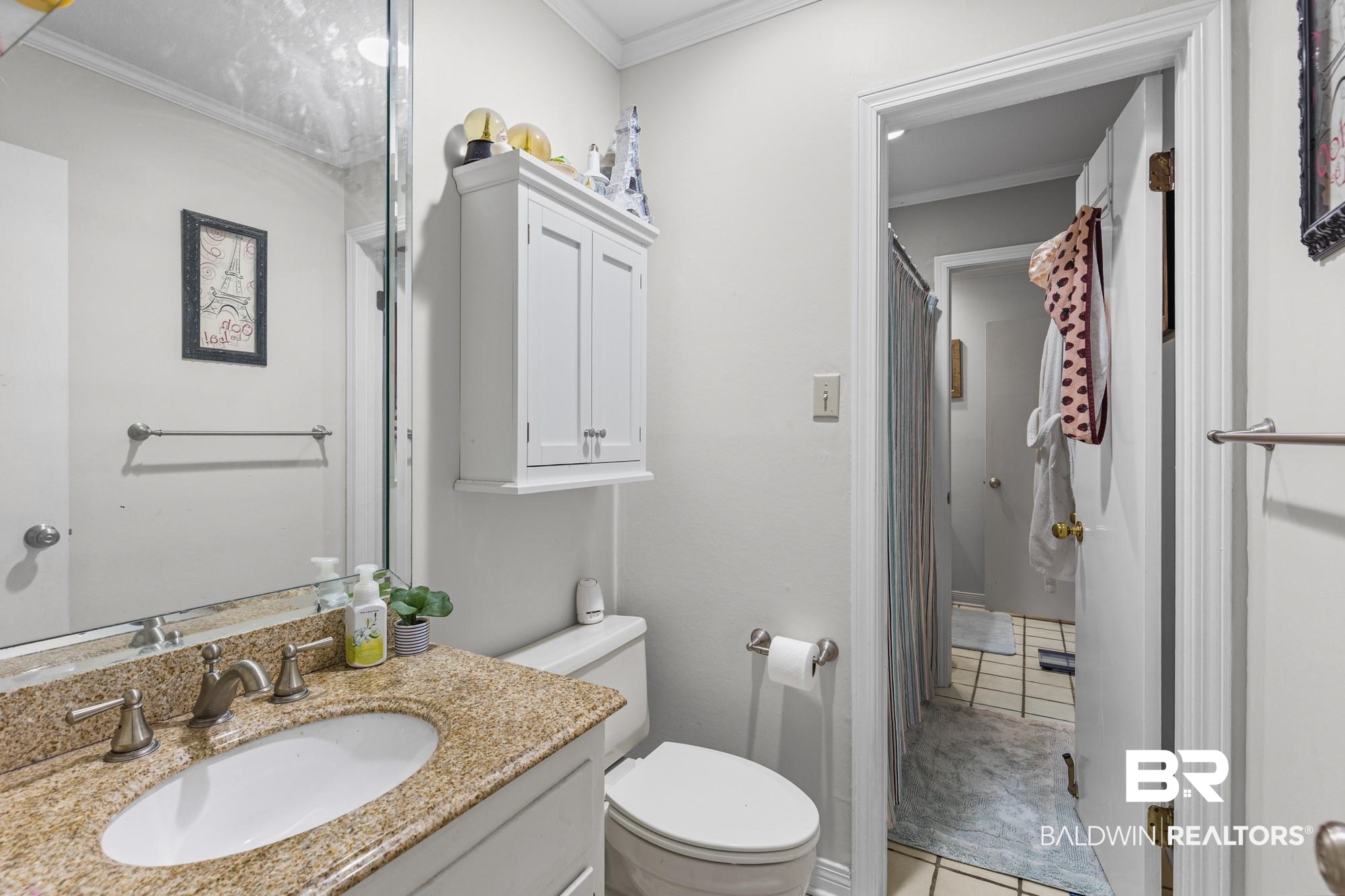 114 Du Rhu Drive, Unit A Mobile, AL 36608 - Photo 12 of 14 Bathroom featuring a shower with curtain, vanity, ornamental molding, and light tile patterned flooring
