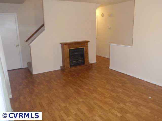 10206 Carol Anne Road Chesterfield, VA 23832 - Photo 2 of 7 a view of an empty room with a fireplace