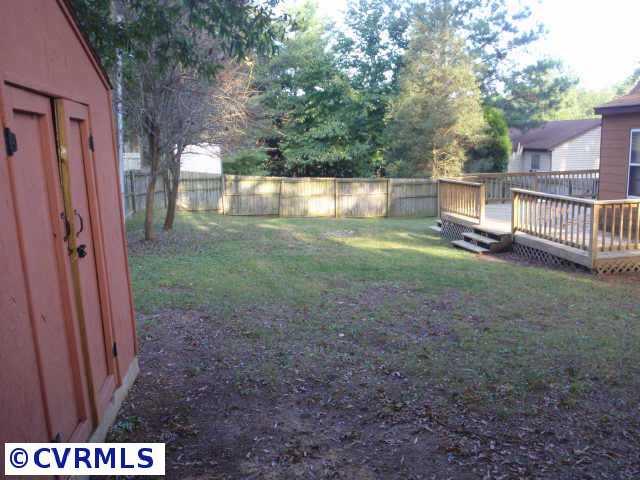 10206 Carol Anne Road Chesterfield, VA 23832 - Photo 4 of 7 a view of a yard with porch and wooden fence