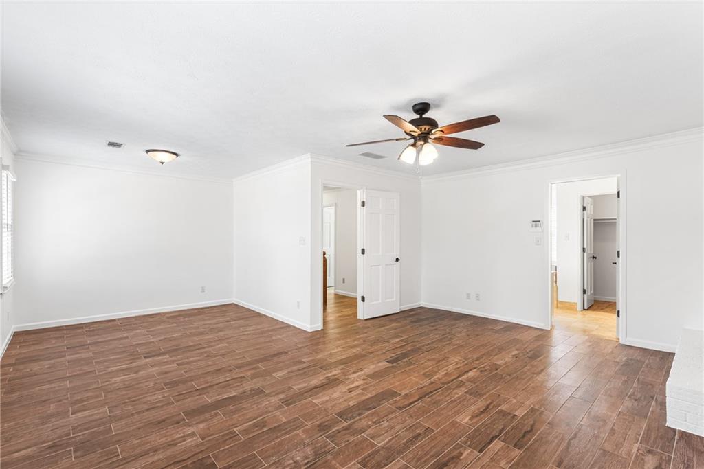 5184 West Price Road Suwanee, GA 30024 - Photo 17 of 25 a view of an empty room with wooden floor