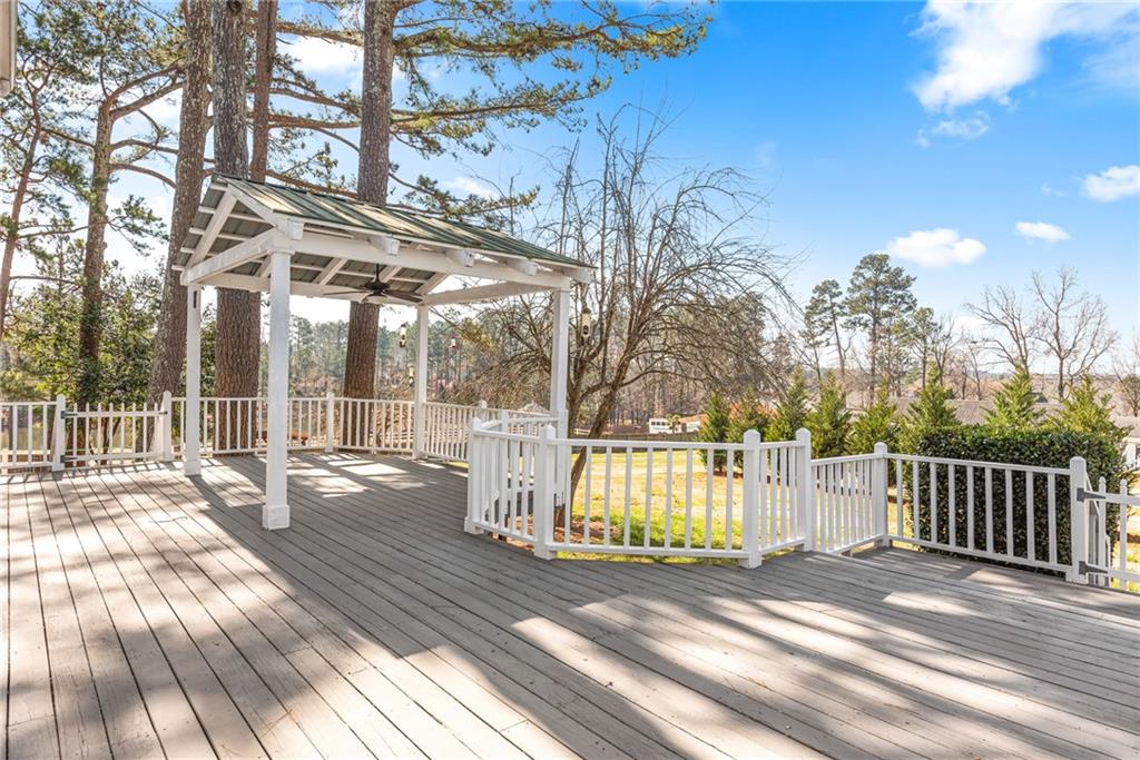 5184 West Price Road Suwanee, GA 30024 - Photo 20 of 25 a view of a house with a yard
