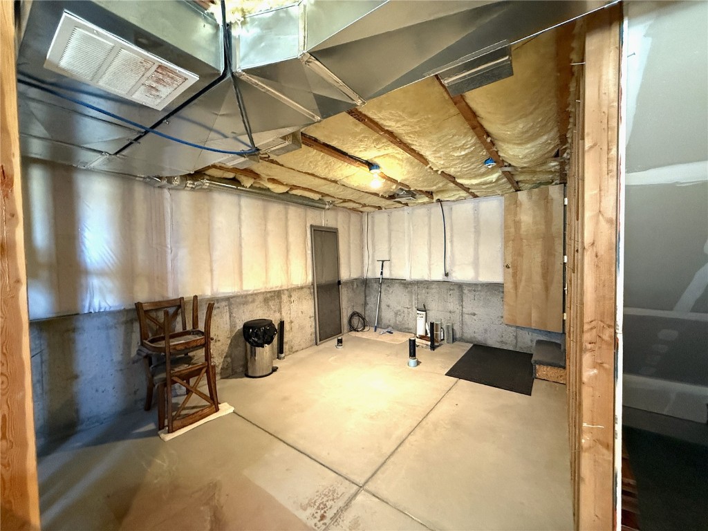 1387 High Creek Road Fairplay, CO 80440 - Photo 33 of 47 a bed room with a bed and a table