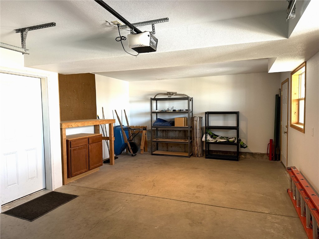 1387 High Creek Road Fairplay, CO 80440 - Photo 37 of 47 a view of a utility room with racks a kitchen space and a window