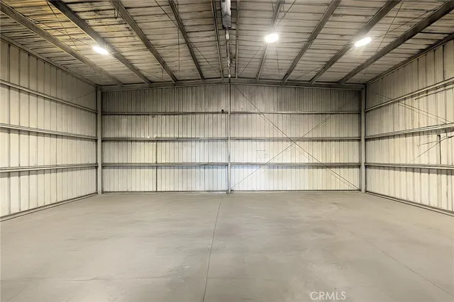 a view of an empty room with racks on the wall
