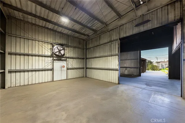 a view of an empty room with a fireplace